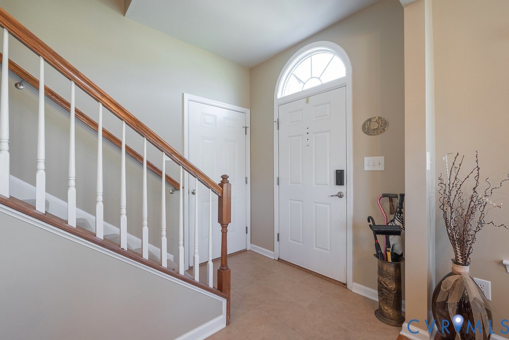 10523 Tea Olive Circle Providence Forge, VA 23140 - Photo 8 of 46 a view of a livingroom with wooden floor and stairs