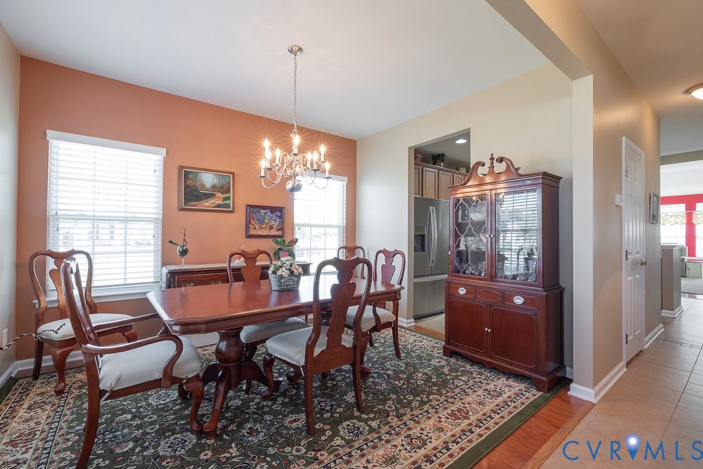 10523 Tea Olive Circle Providence Forge, VA 23140 - Photo 9 of 46 a view of a dining room with furniture window and wooden floor