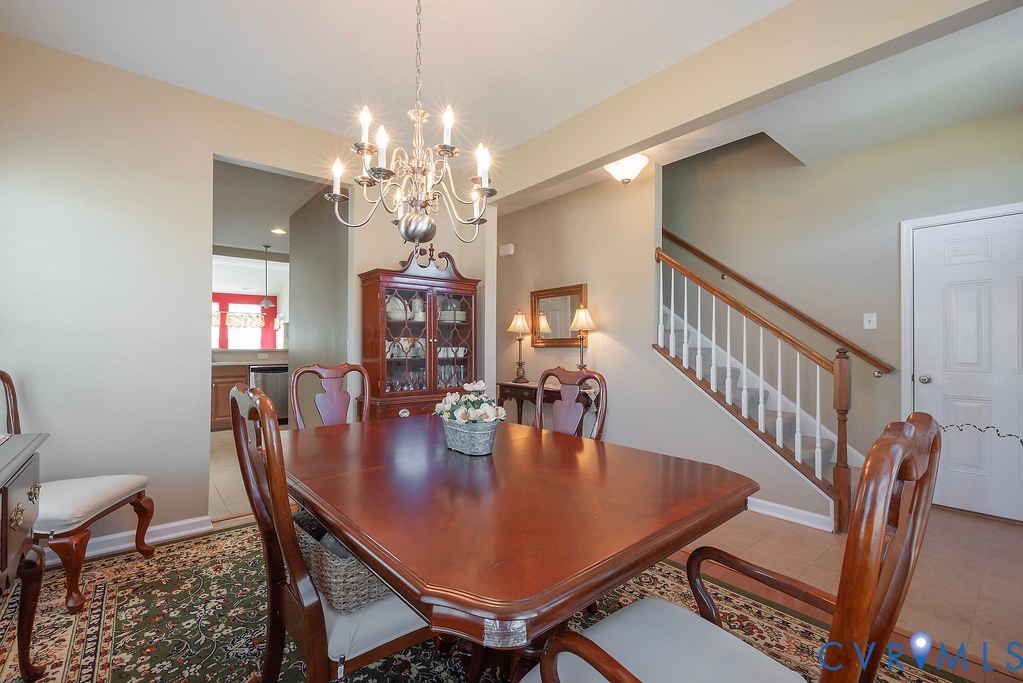 10523 Tea Olive Circle Providence Forge, VA 23140 - Photo 10 of 46 a view of a dining room with furniture and a chandelier
