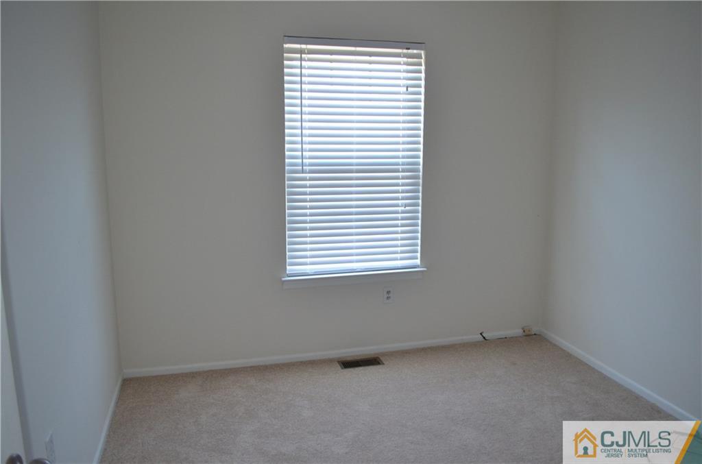 225 Constitution Circle North Brunswick, NJ 08902 - Photo 15 of 17 an empty room with a window