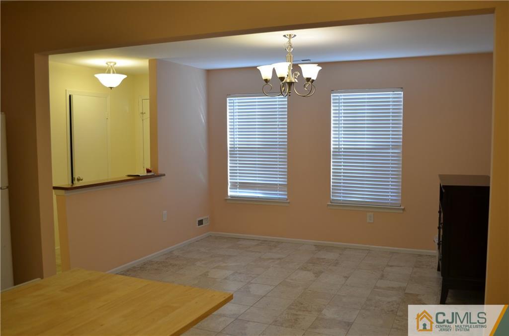 225 Constitution Circle North Brunswick, NJ 08902 - Photo 4 of 17 a view of livingroom and window