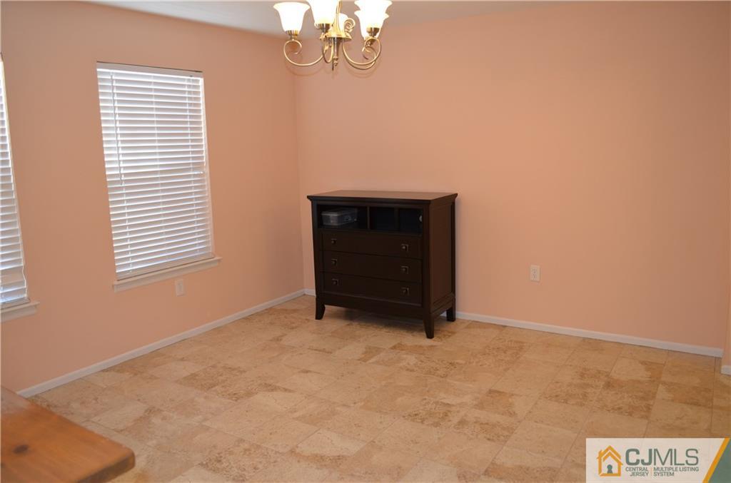 225 Constitution Circle North Brunswick, NJ 08902 - Photo 5 of 17 a view of an empty room with a window