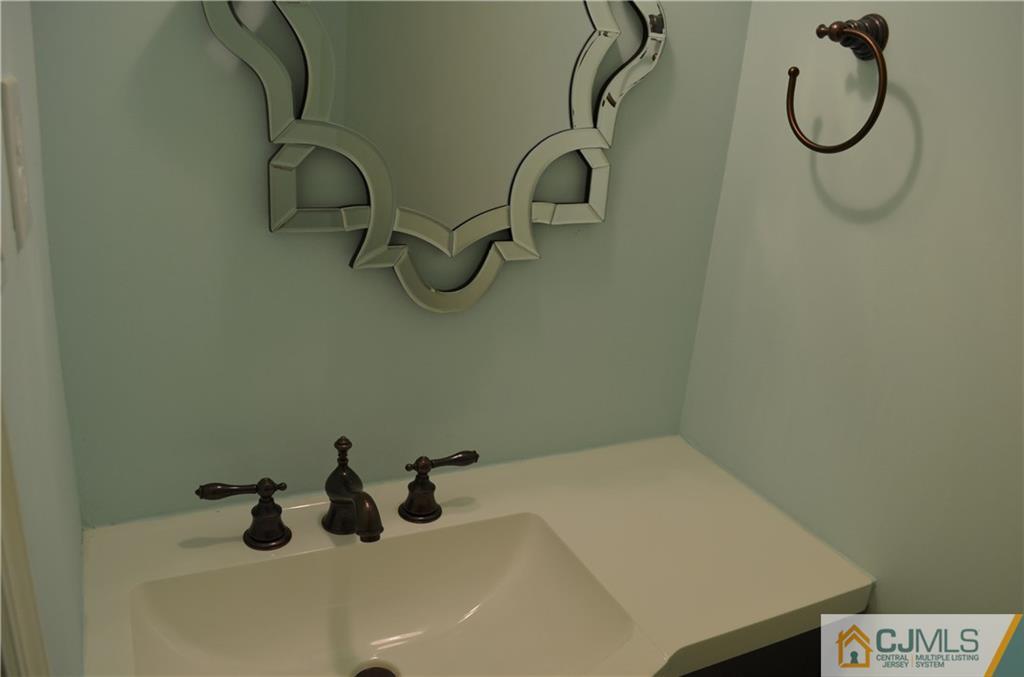 225 Constitution Circle North Brunswick, NJ 08902 - Photo 8 of 17 a bathroom with a sink