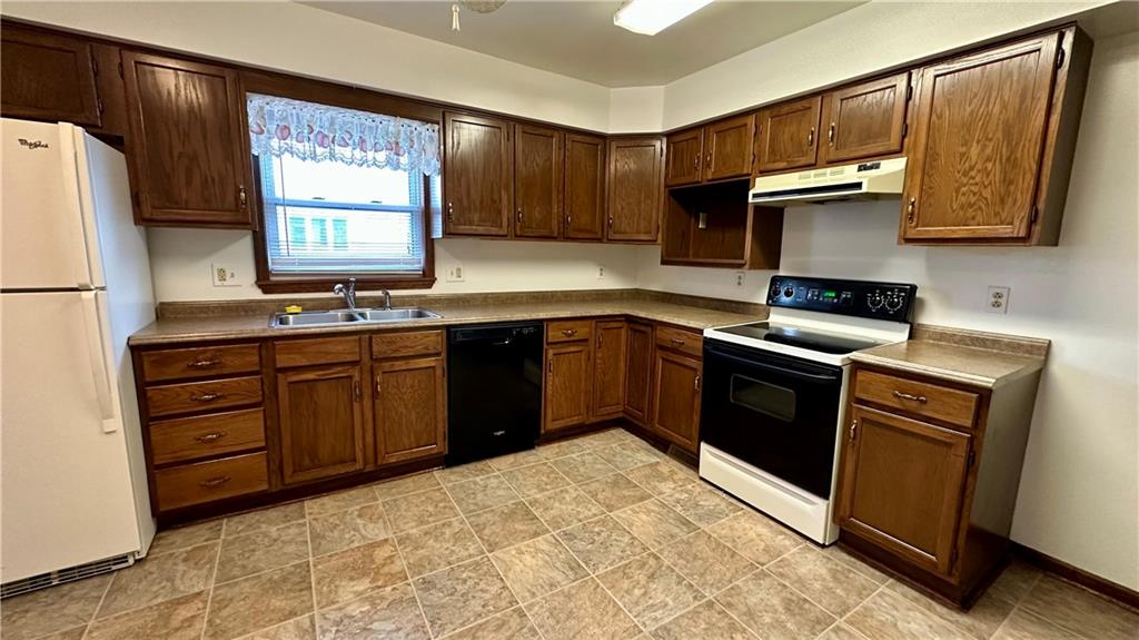 820-822 Jacoby Road Harwick, PA 15049 - Photo 22 of 44 820 MAIN KITCHEN DISPLAYING RANGE, DISHWASHER AND REFRIGERATOR.