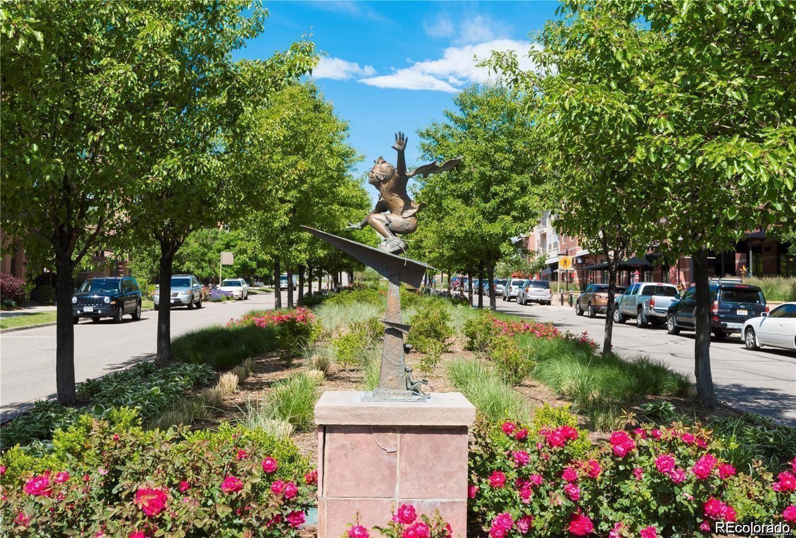 10111 Inverness Main Street, Unit 301 Englewood, CO 80112 - Photo 16 of 28 a view of a garden with flowers and trees