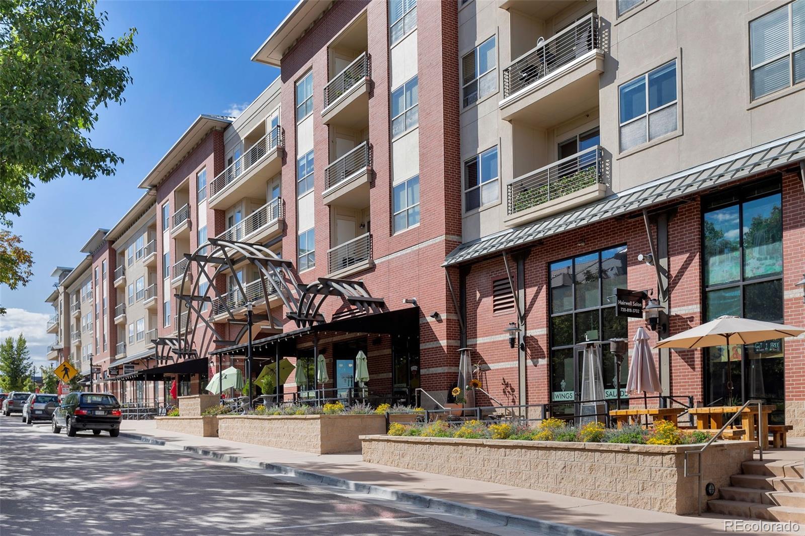 10111 Inverness Main Street, Unit 301 Englewood, CO 80112 - Photo 18 of 28 a view of street with shops