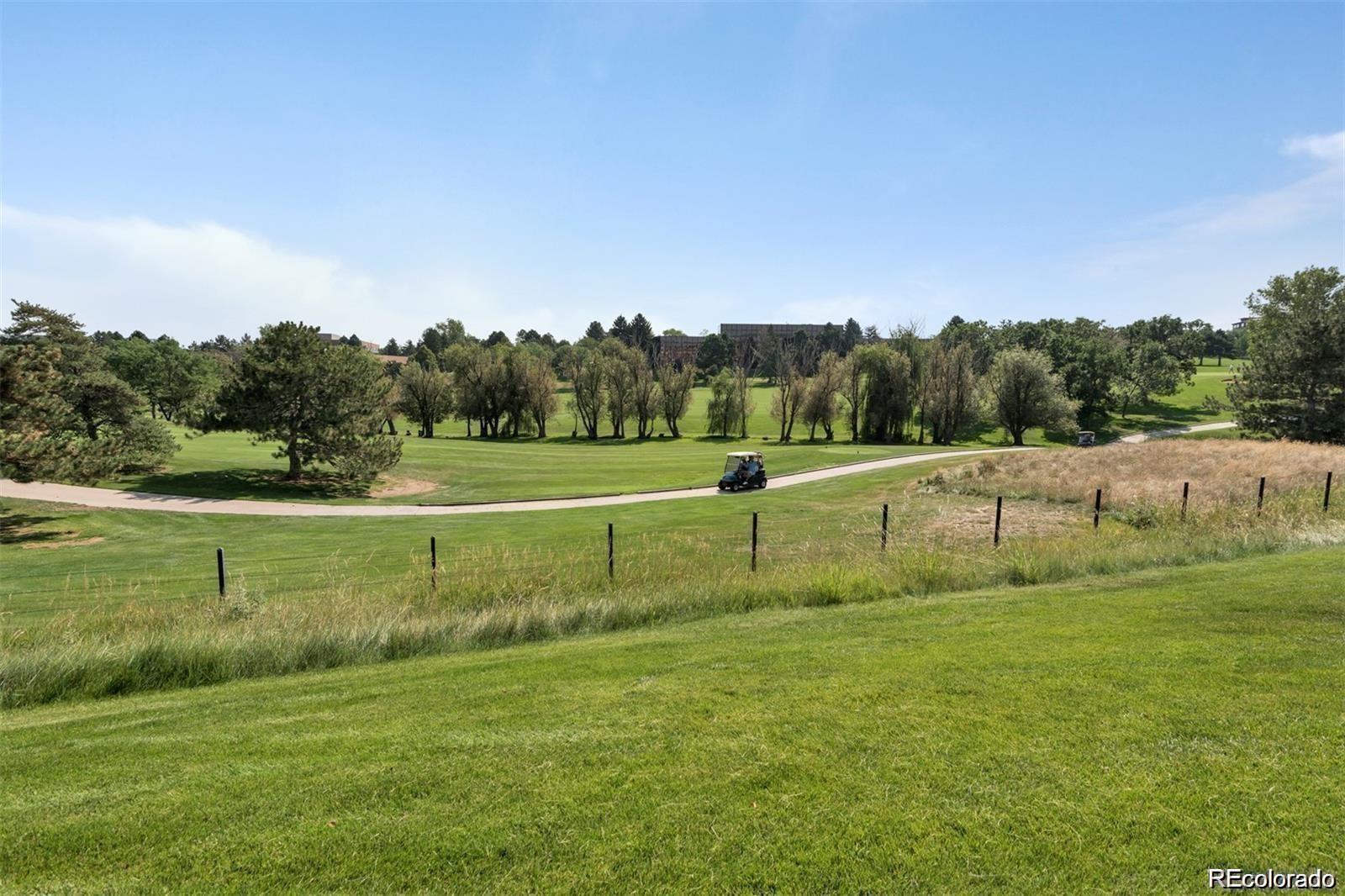10111 Inverness Main Street, Unit 301 Englewood, CO 80112 - Photo 25 of 28 a view of field with tall trees