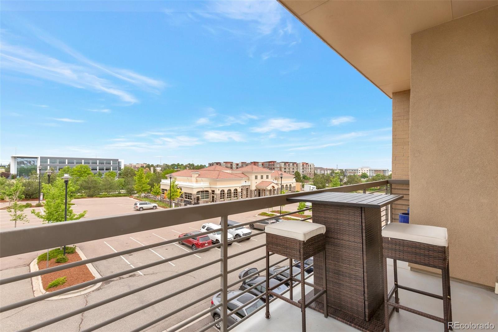 10111 Inverness Main Street, Unit 301 Englewood, CO 80112 - Photo 7 of 28 a view of city from terrace with seating space