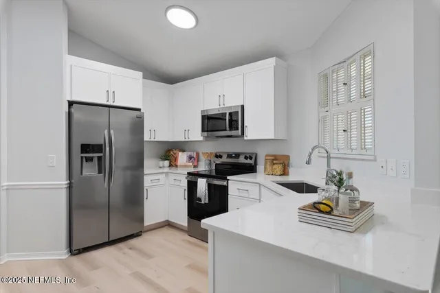 a room that has a window and a table in it