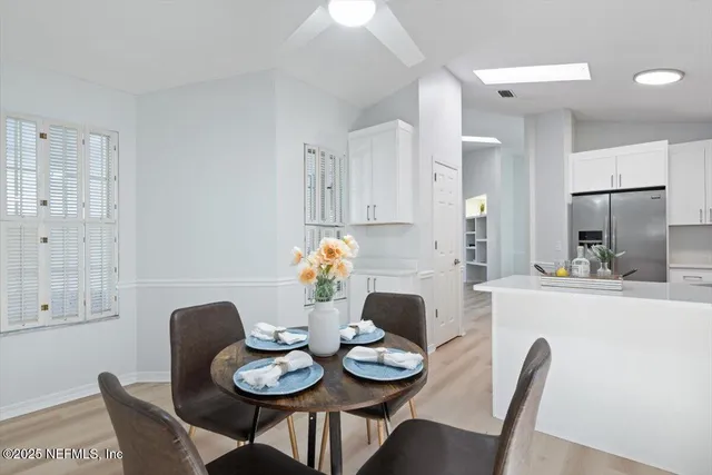 a view of a patio with couches chairs and potted plants