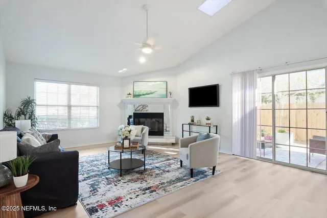 a view of a patio with table and chairs and potted plants