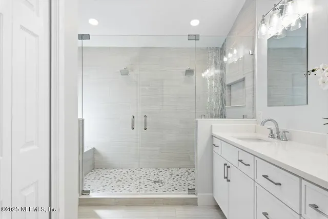 a kitchen with stainless steel appliances granite countertop a refrigerator stove top oven and sink