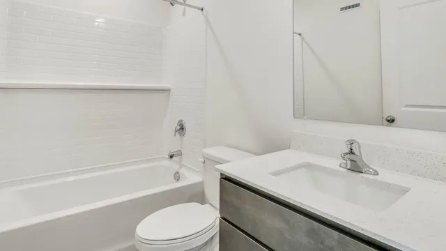a bathroom with a sink a toilet and a bathtub