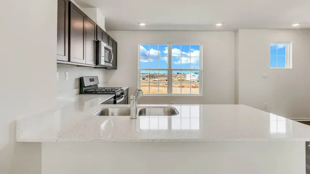 a bathroom with a bathtub sink and mirror