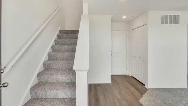 a view of entryway with wooden floor