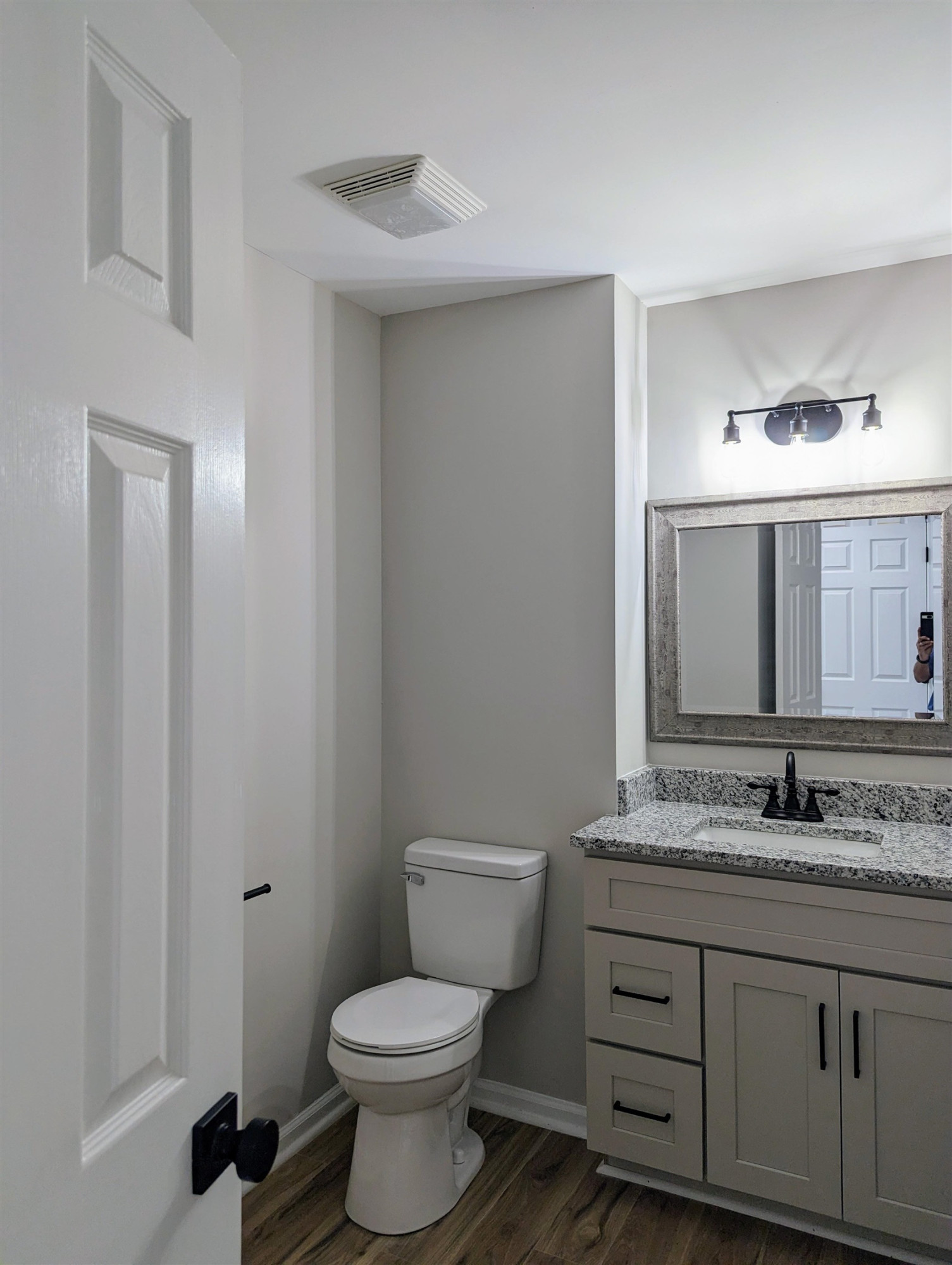 2 Austin Court Durham, NC 27707 - Photo 14 of 29 a bathroom with a granite countertop toilet sink and mirror