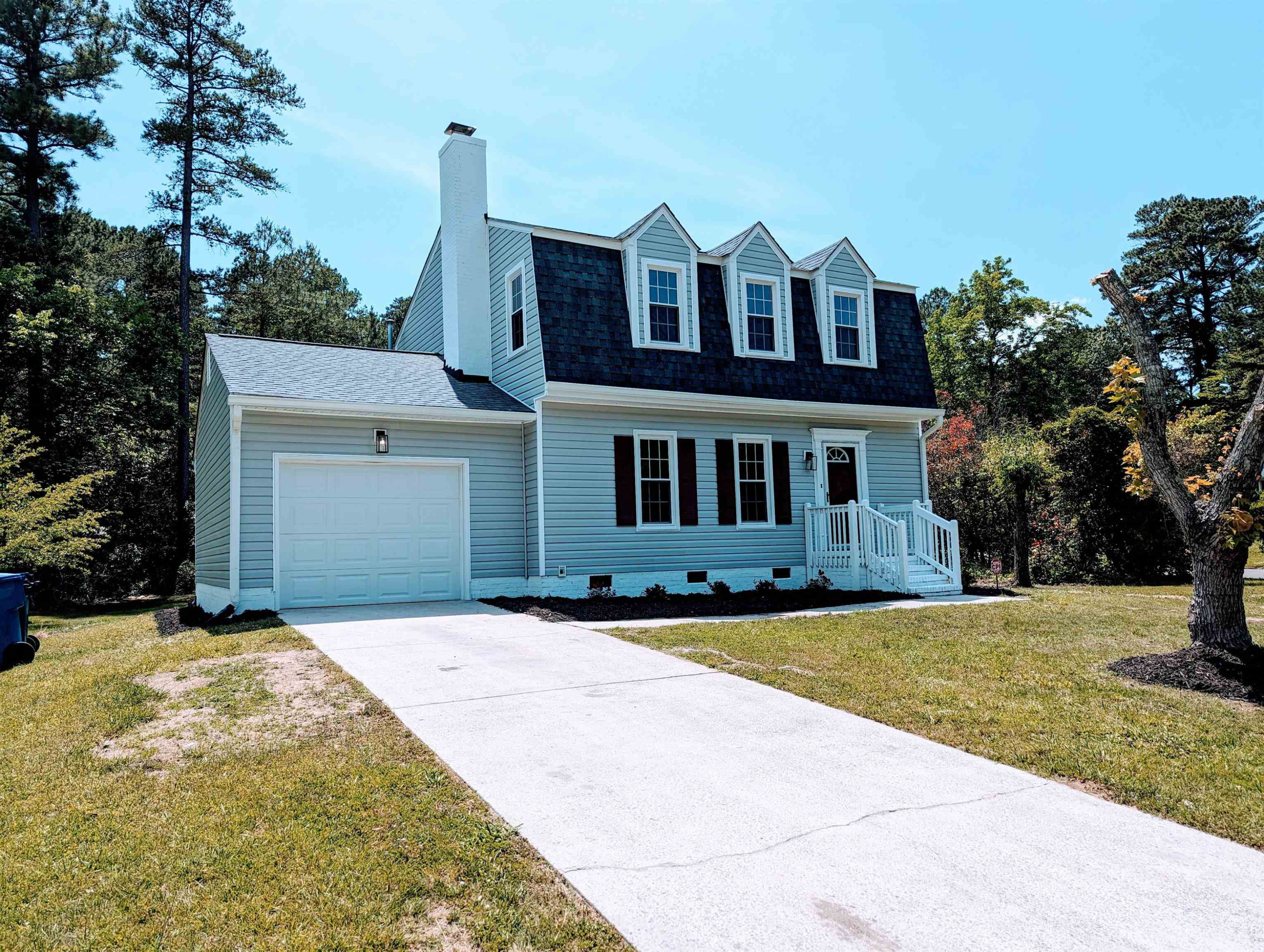 2 Austin Court Durham, NC 27707 - Photo 2 of 29 a front view of a house with a yard