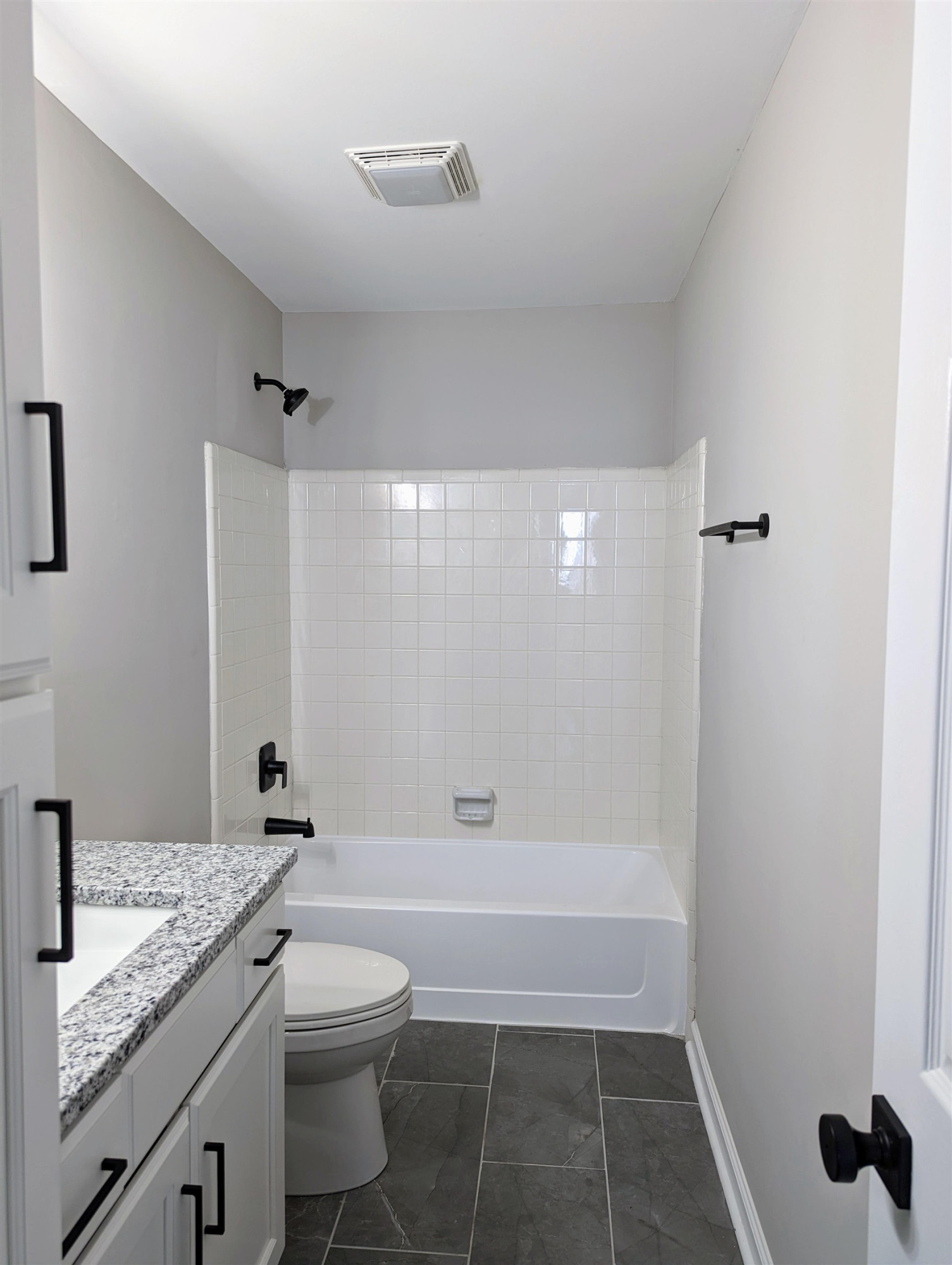 2 Austin Court Durham, NC 27707 - Photo 26 of 29 a bathroom with a granite countertop sink a toilet and shower