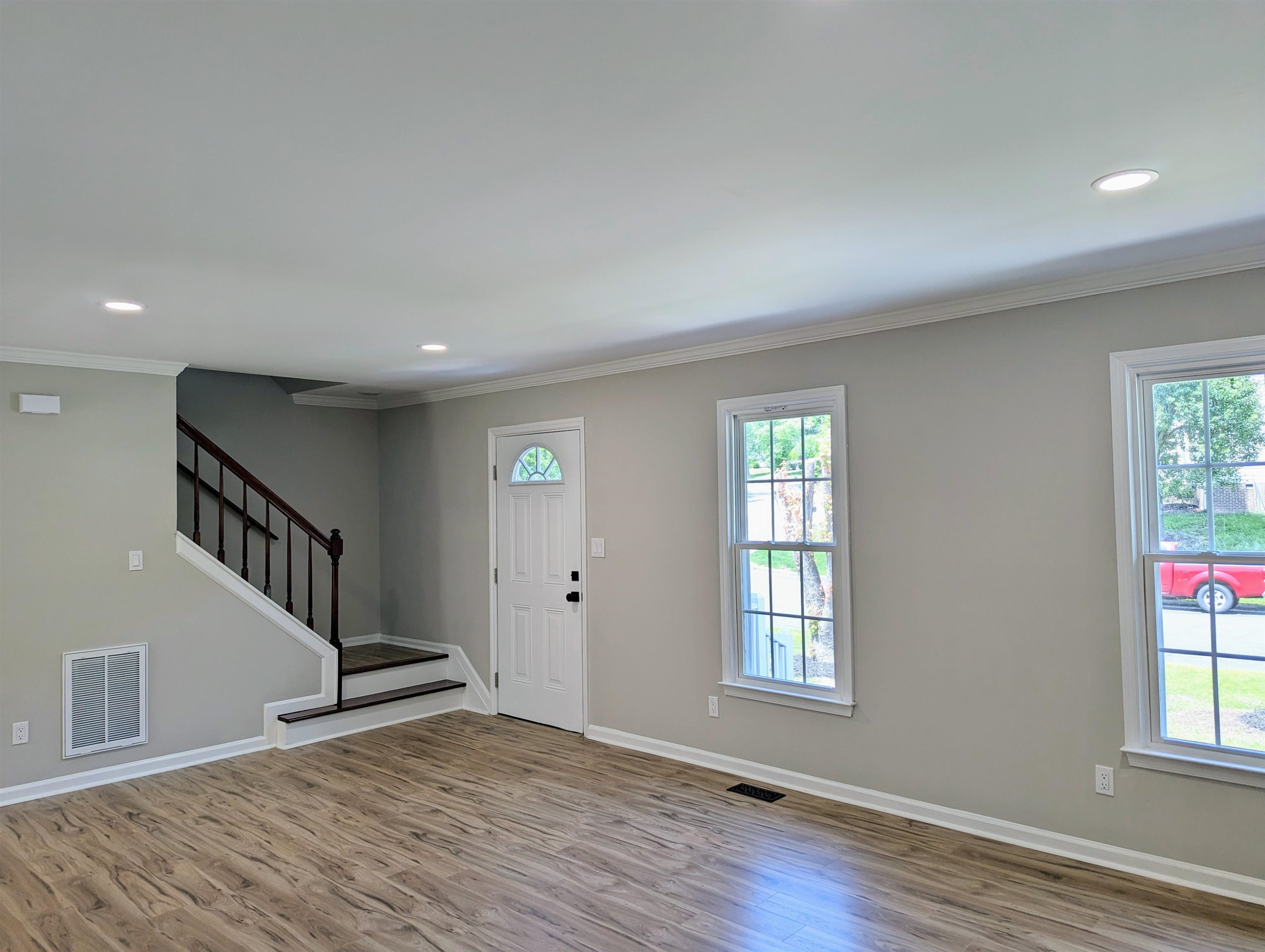 2 Austin Court Durham, NC 27707 - Photo 7 of 29 a view of an empty room with wooden floor and a window