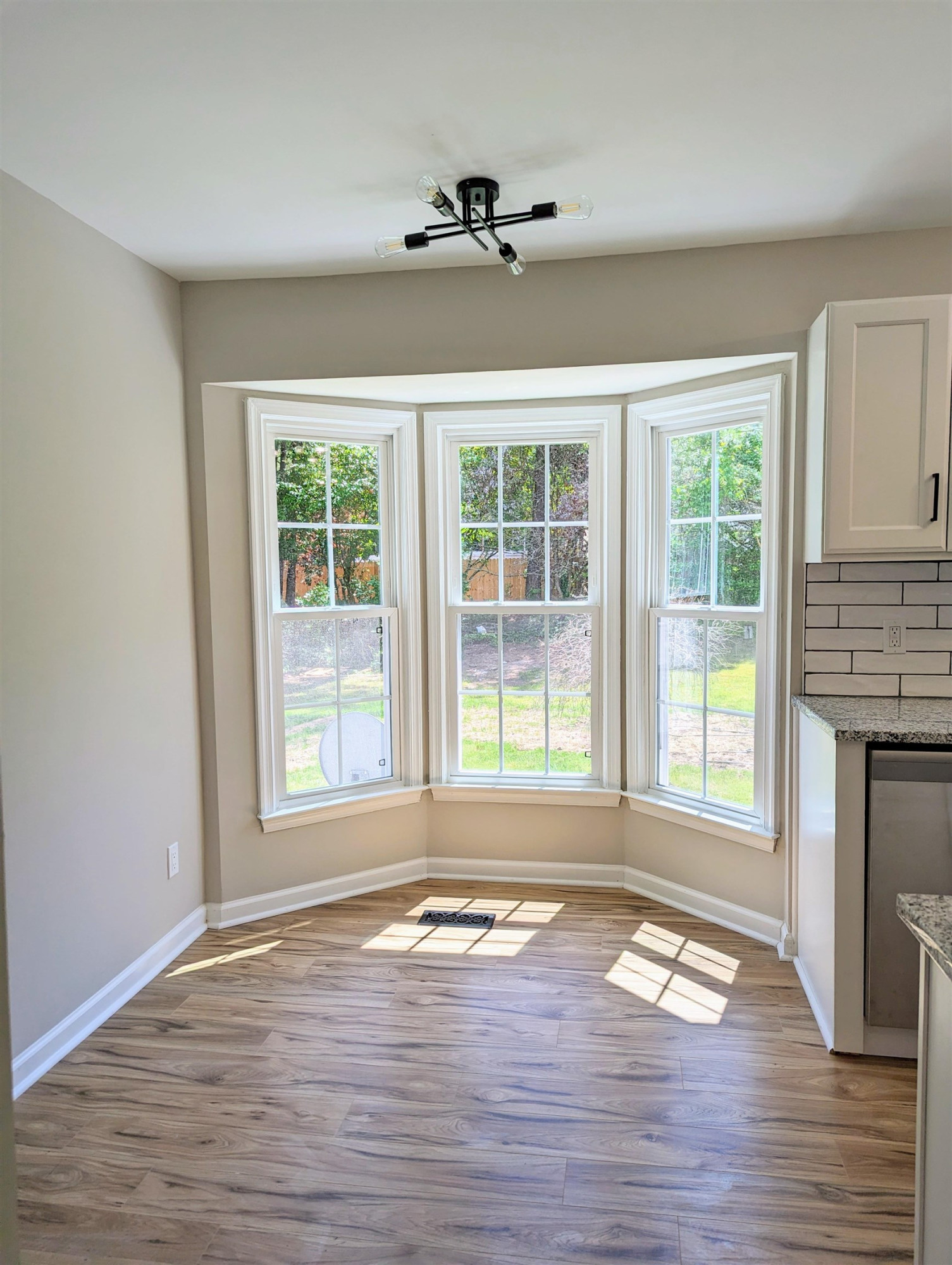 2 Austin Court Durham, NC 27707 - Photo 8 of 29 a view of empty room with wooden floor and fireplace