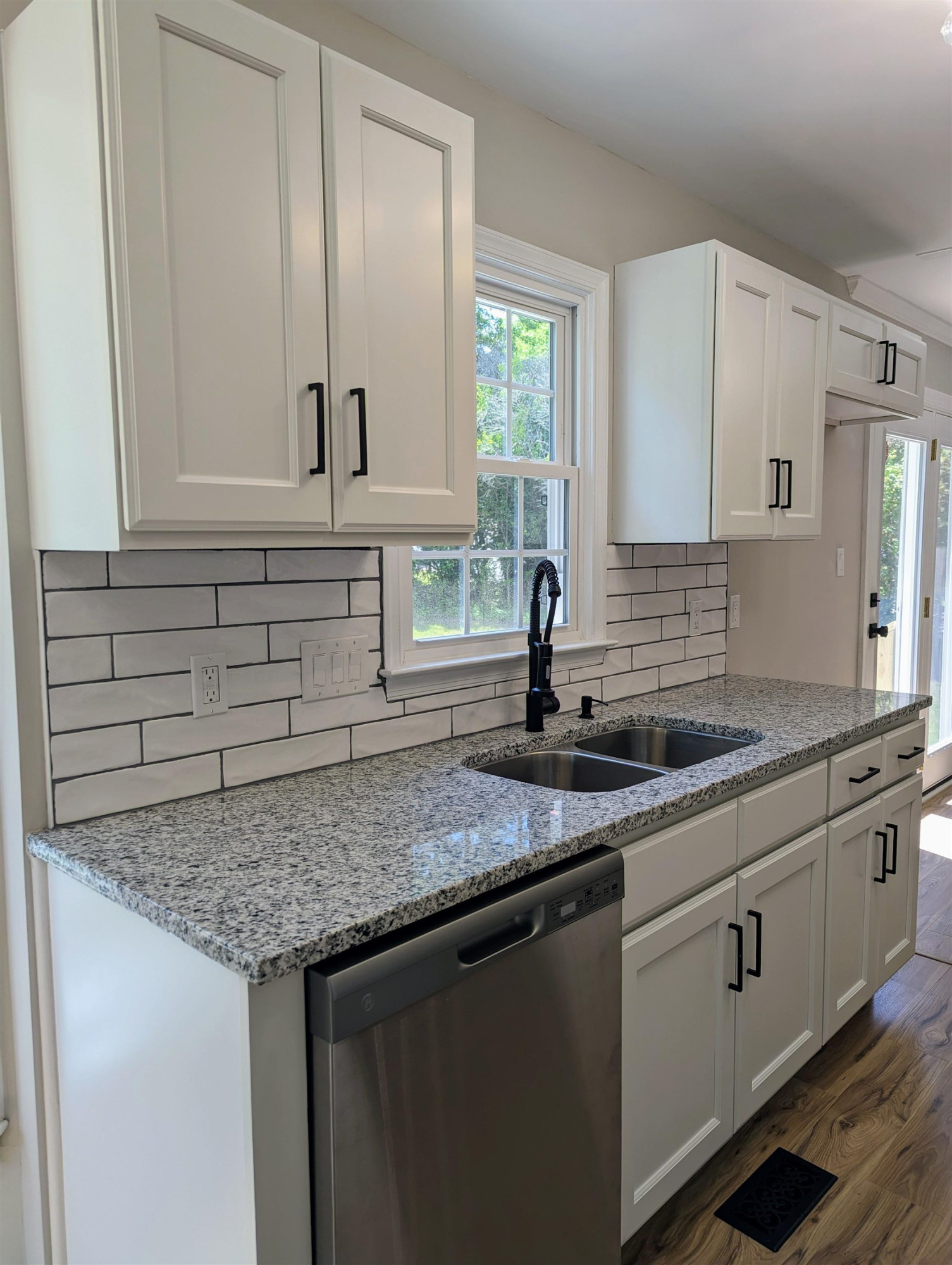 2 Austin Court Durham, NC 27707 - Photo 10 of 29 a kitchen with granite countertop a sink and cabinets