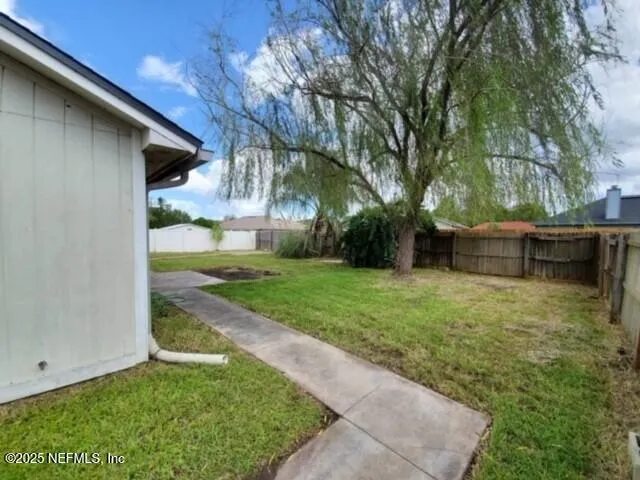 a view of a back yard of the house