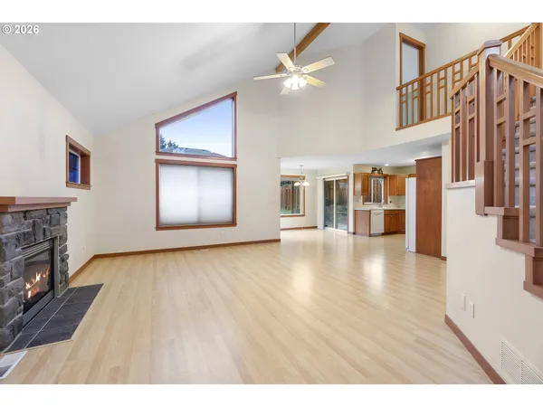 a view interior of a house livingroom with fireplace and wooden floor