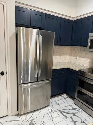 a bathroom with a sink and a microwave