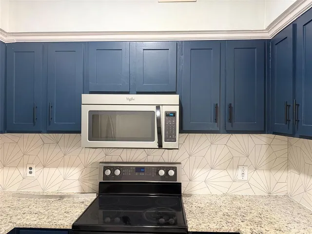 a view of bathroom with a refrigerator