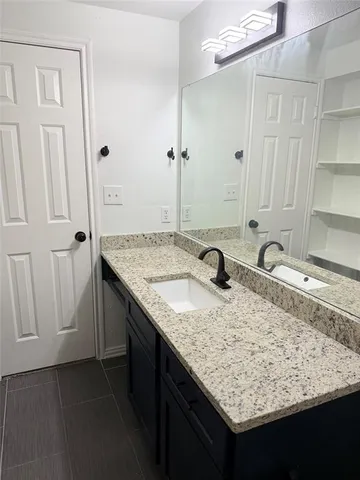 a bathroom with a shower and a toilet