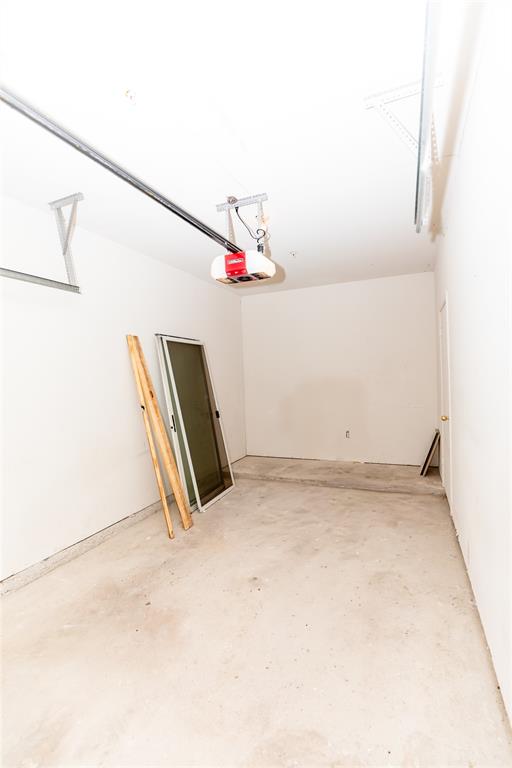 2601 Preston Road, Unit 7203 Plano, TX 75093 - Photo 27 of 27 View of front facade with driveway and stucco siding