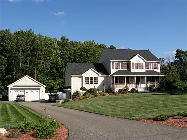 120 Rice Corner Road Brookfield, MA 01506 - Photo 1 of 28 a front view of a house with a garden and plants