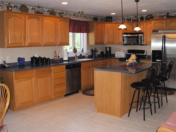 120 Rice Corner Road Brookfield, MA 01506 - Photo 2 of 28 a kitchen with stainless steel appliances granite countertop a stove top oven a sink dishwasher and cabinets with wooden floor