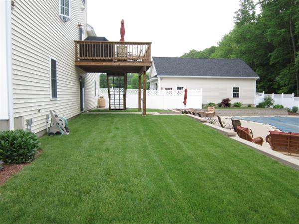 120 Rice Corner Road Brookfield, MA 01506 - Photo 28 of 28 a view of a house with a backyard and a patio