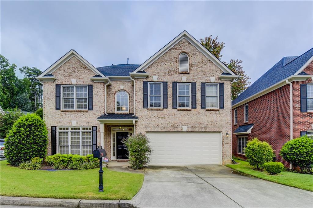 2360 Mill Ridge Trail Atlanta, GA 30345 - Photo 1 of 1 a front view of a house with a garden and plants