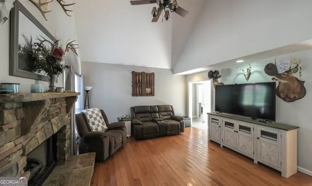 a living room with furniture and a flat screen tv