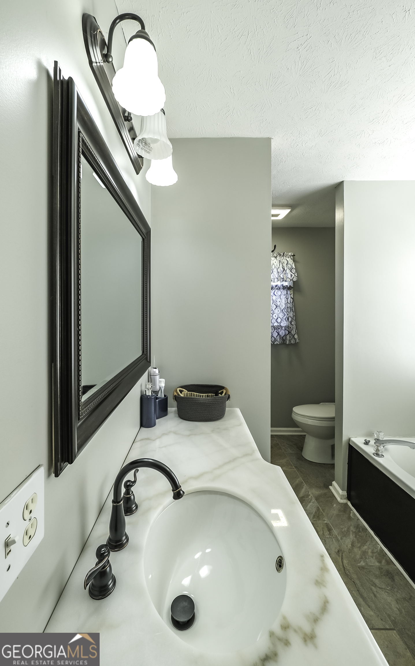 1001 Vong Street Waco, GA 30182 - Photo 13 of 45 a bathroom with a sink and a mirror