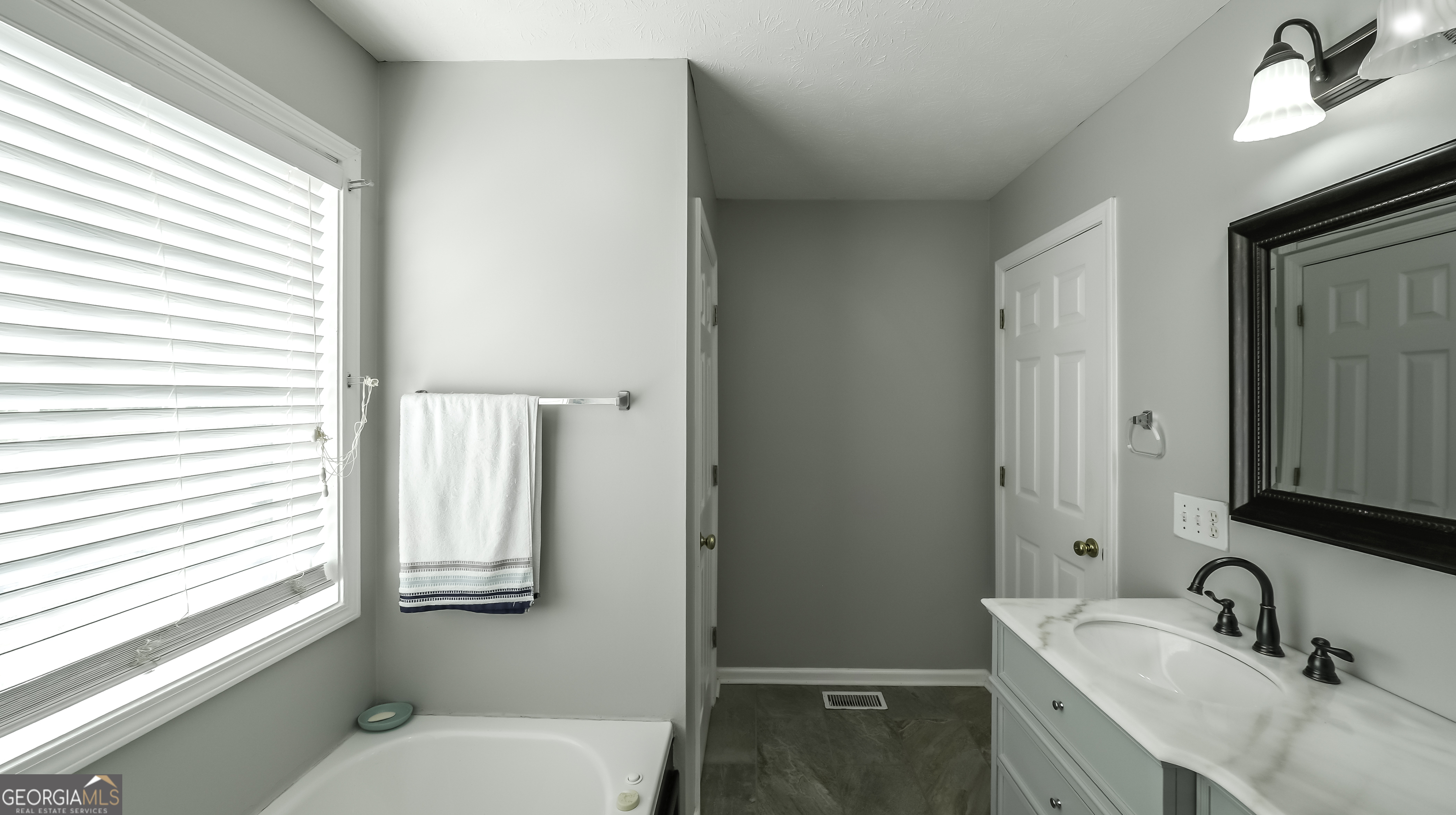 1001 Vong Street Waco, GA 30182 - Photo 17 of 45 a bathroom with a granite countertop sink toilet and shower