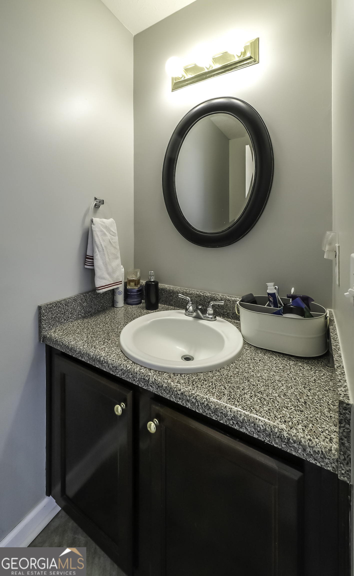 1001 Vong Street Waco, GA 30182 - Photo 22 of 45 a bathroom with a granite countertop sink a mirror and vanity