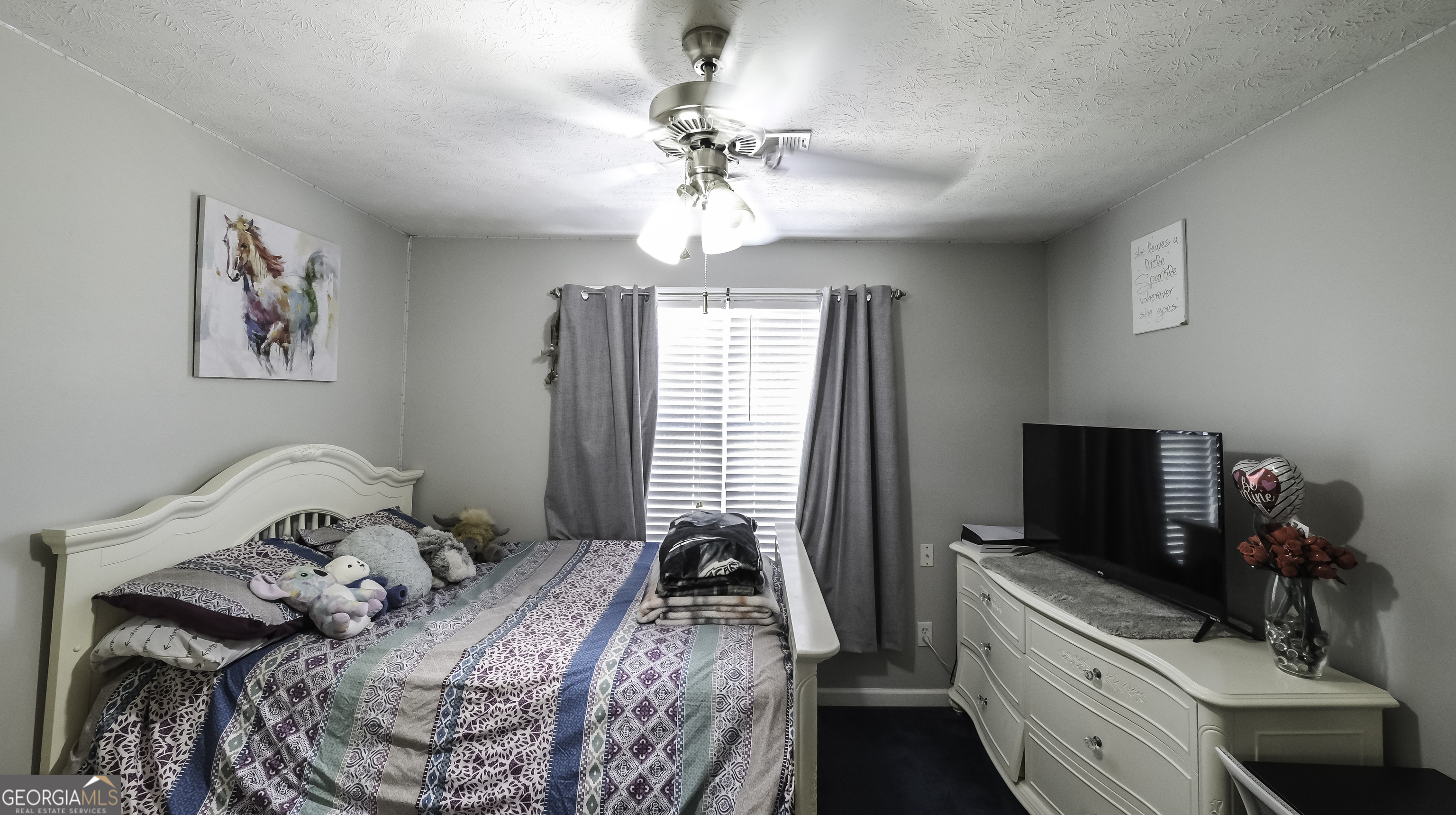 1001 Vong Street Waco, GA 30182 - Photo 24 of 45 a bedroom with a bed and a chandelier