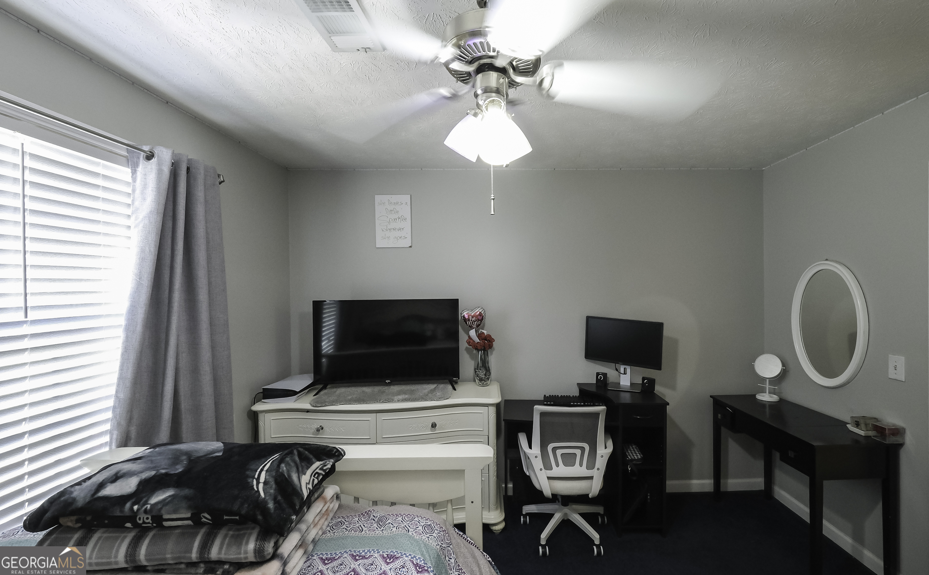 1001 Vong Street Waco, GA 30182 - Photo 25 of 45 a living room with furniture a flat screen tv and a window