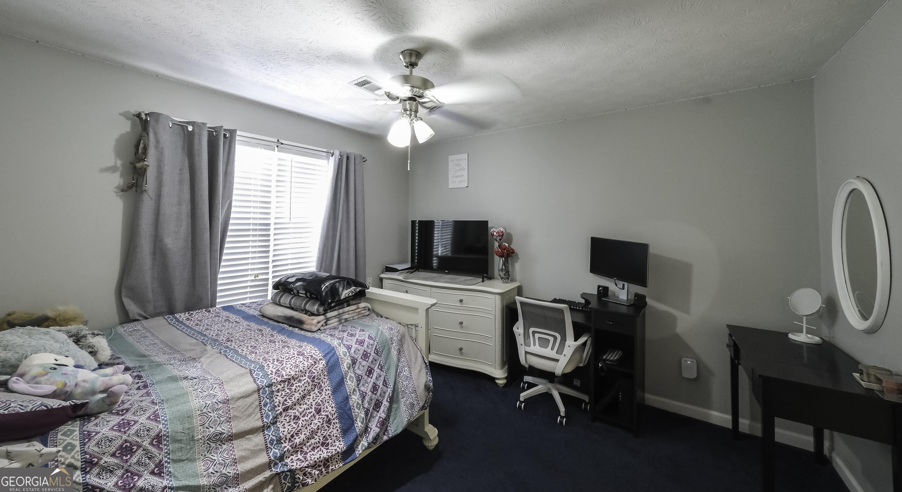 1001 Vong Street Waco, GA 30182 - Photo 26 of 45 a bedroom with a bed and a flat screen tv
