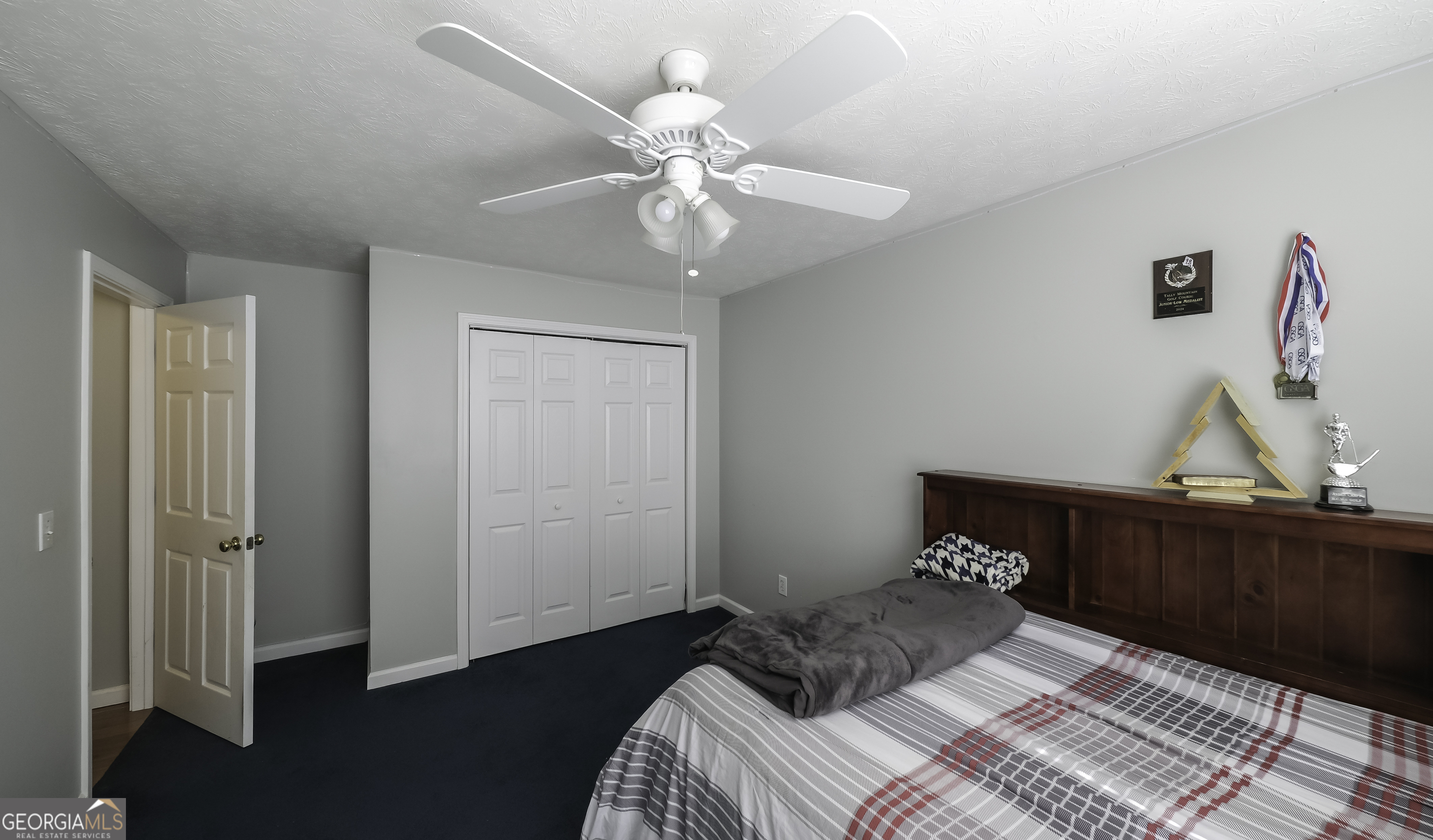 1001 Vong Street Waco, GA 30182 - Photo 27 of 45 a bedroom with a bed and wooden floor