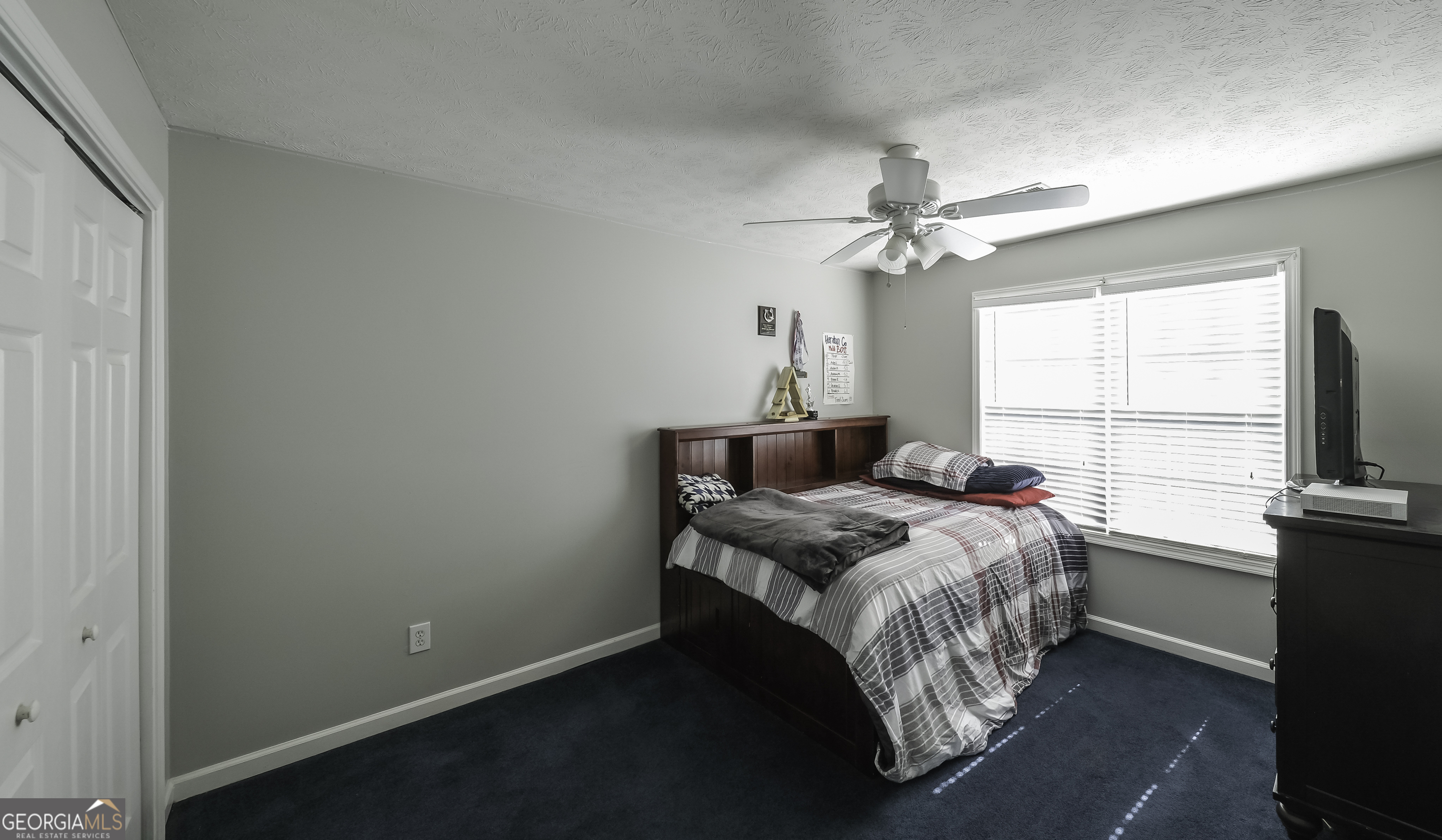 1001 Vong Street Waco, GA 30182 - Photo 29 of 45 a bed sitting in a bedroom next to a window