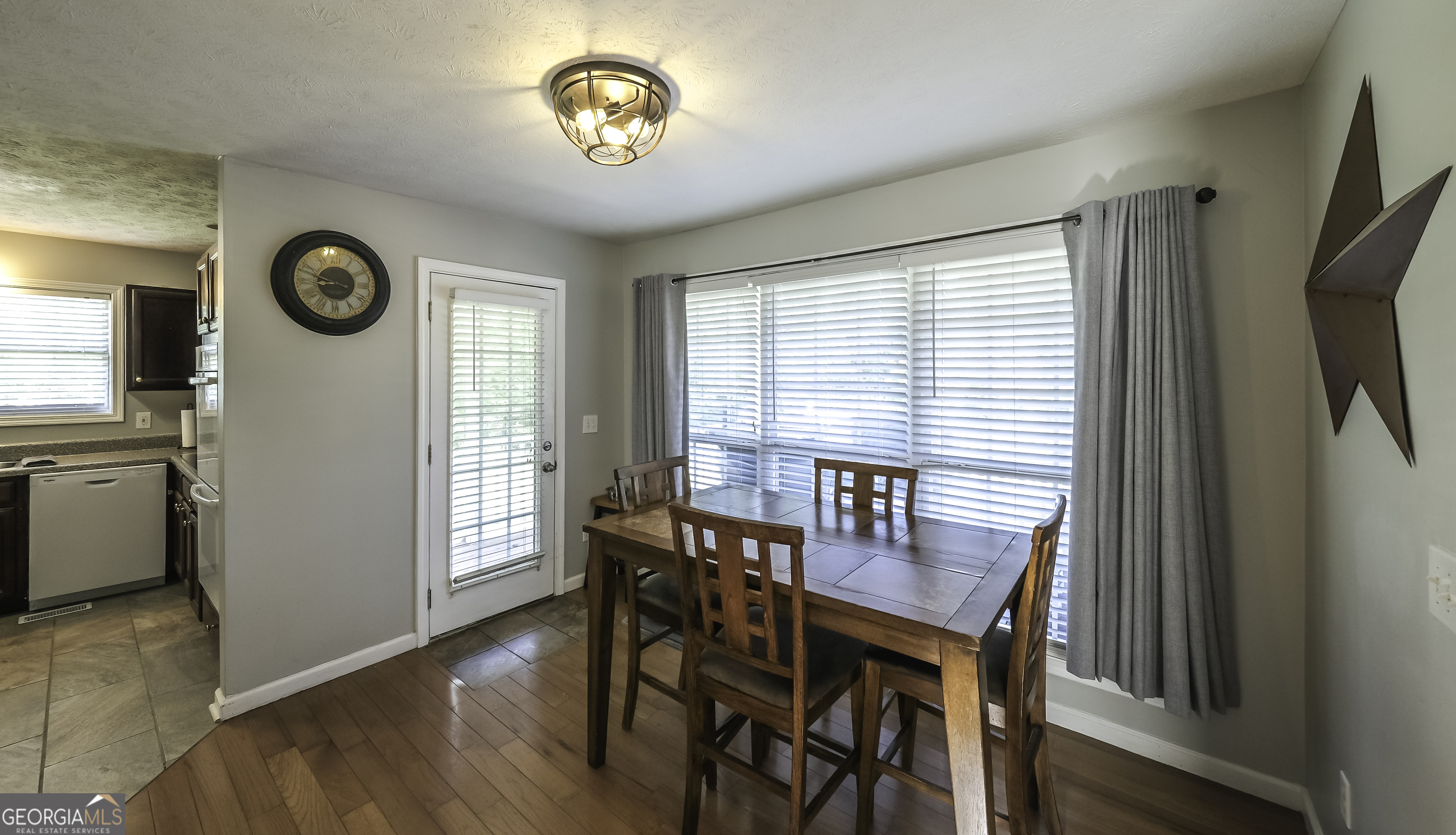 1001 Vong Street Waco, GA 30182 - Photo 3 of 45 a view of a dining room with furniture window and wooden floor