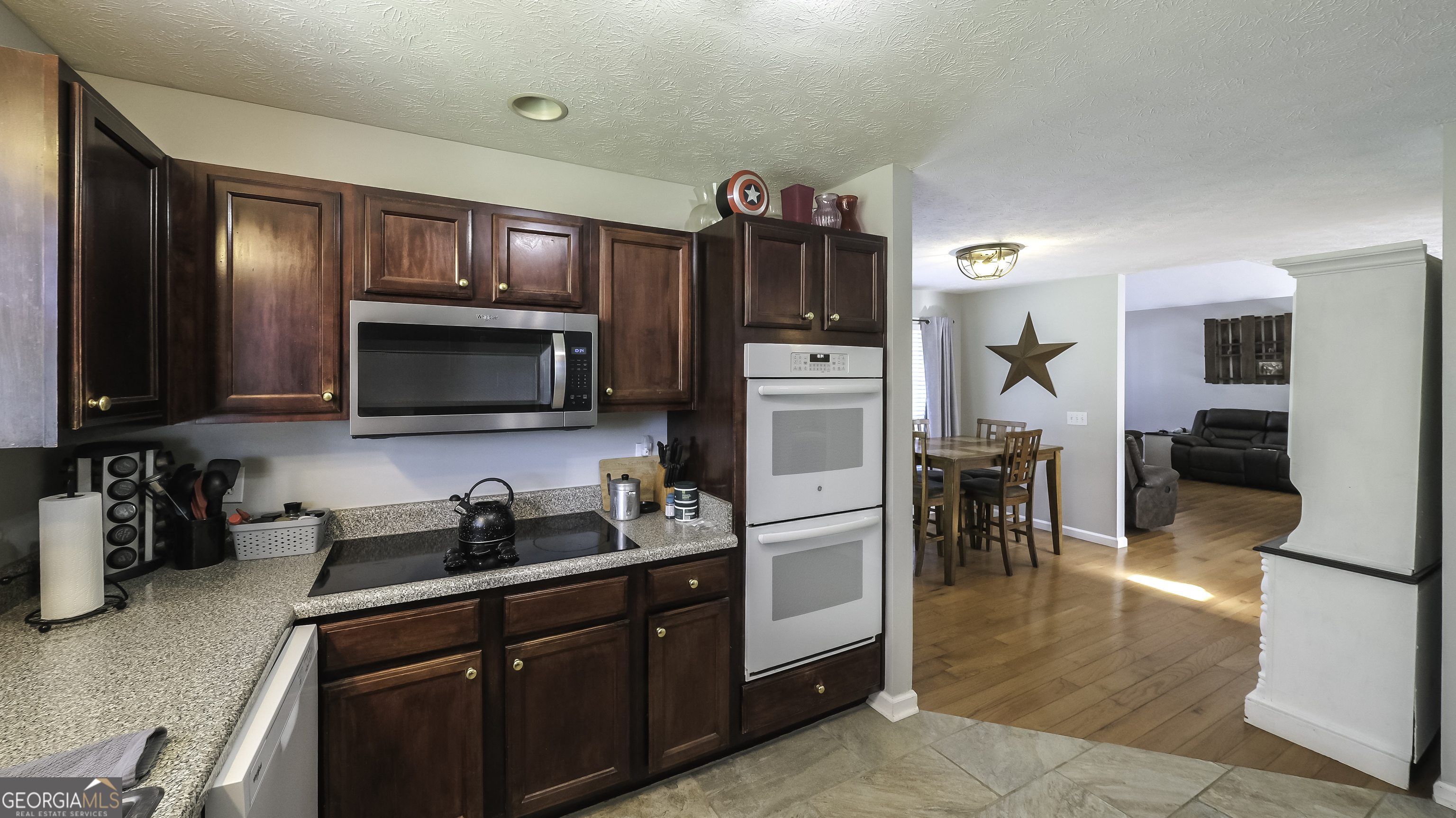 1001 Vong Street Waco, GA 30182 - Photo 5 of 45 a kitchen that has a lot of cabinets and refrigerator in it