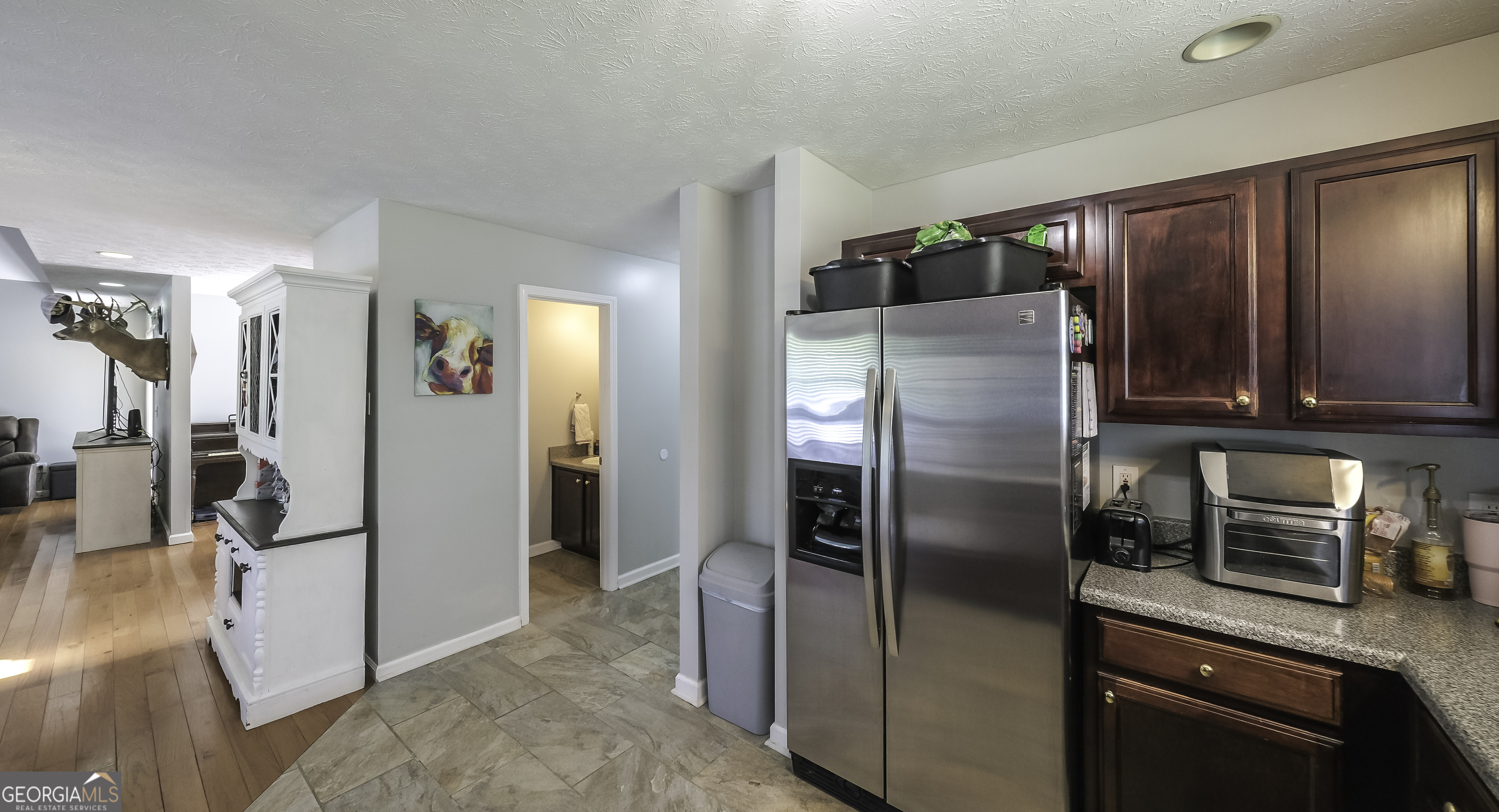 1001 Vong Street Waco, GA 30182 - Photo 6 of 45 a kitchen with stainless steel appliances granite countertop a refrigerator and a sink
