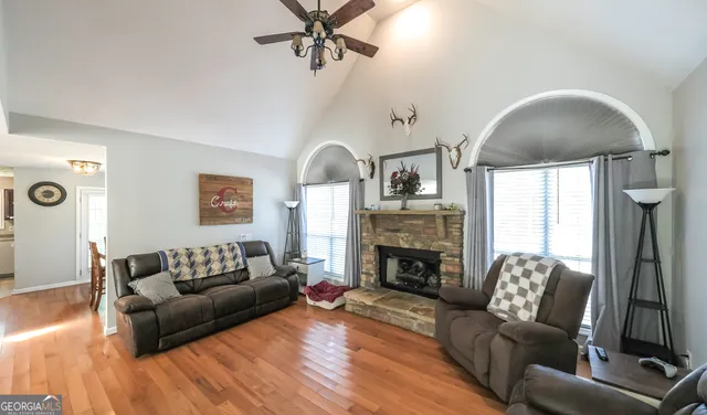 a living room with furniture and a fireplace