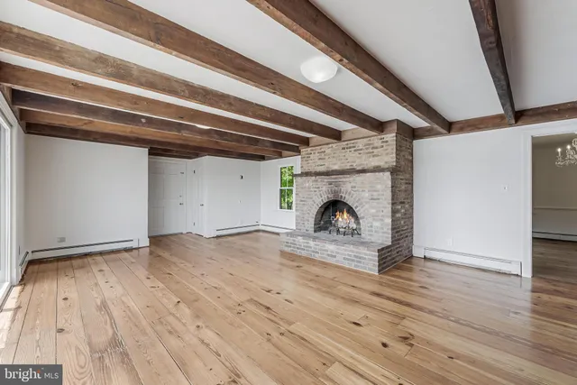 a view of an empty room with a bathroom