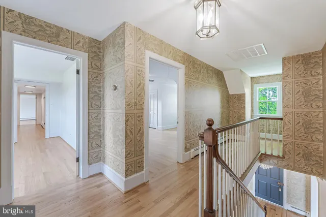 a view of a hallway with washer and dryer